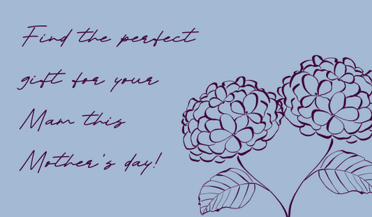 Text in dark magenta on a cornflower blue background saying Find the perfect gift for your Mam this Mother's Day! There is also a pair of hyrangeas in dark magenta, twisted together in a heart shape.