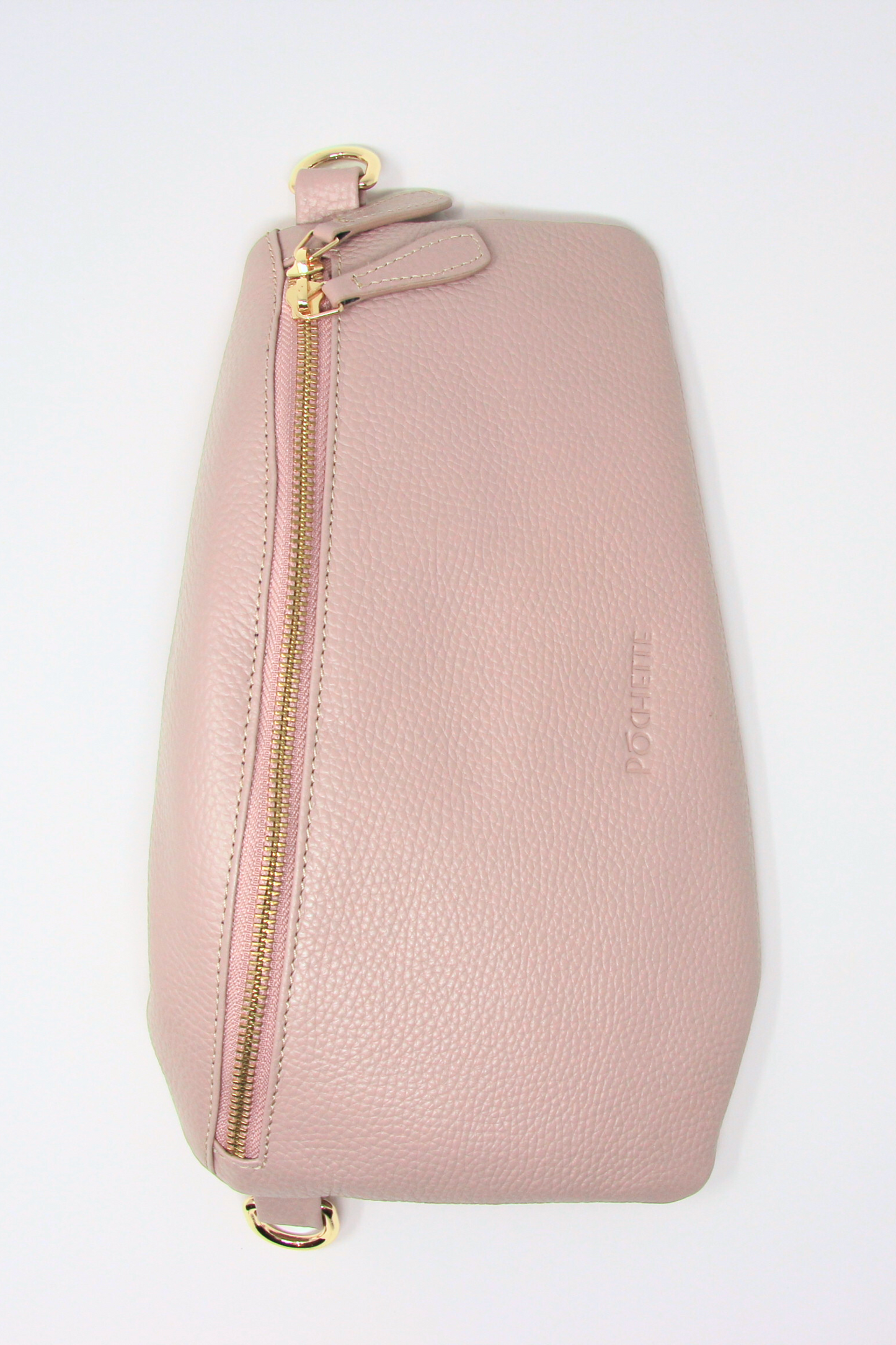 A powder pink swing crossbody bag called the Póca