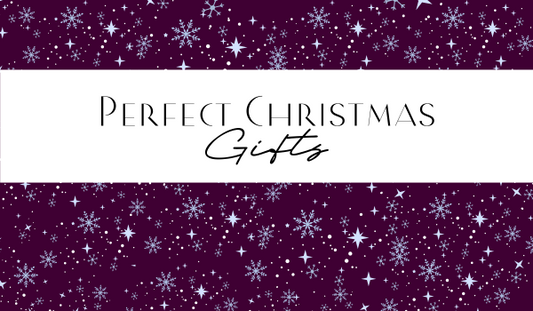 Perfect Christmas Gifts written in dark magenta on white on top of a dark magenta snowflake filled background.  